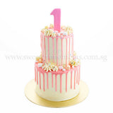 Halal-certified customised cakes by Sweetest Moments Singapore, freshly made and perfect for all occasions – from pre-school celebrations to full month, 100 days, 1st and kids’ birthdays, weddings, guo da li, corporate events, and anniversaries. Available in chocolate, vanilla, red velvet, and eggless cakes with buttercream or fondant frosting. Free delivery available. tall cake, pink chocolate drip, marshmallows, sprinkles, dessert table