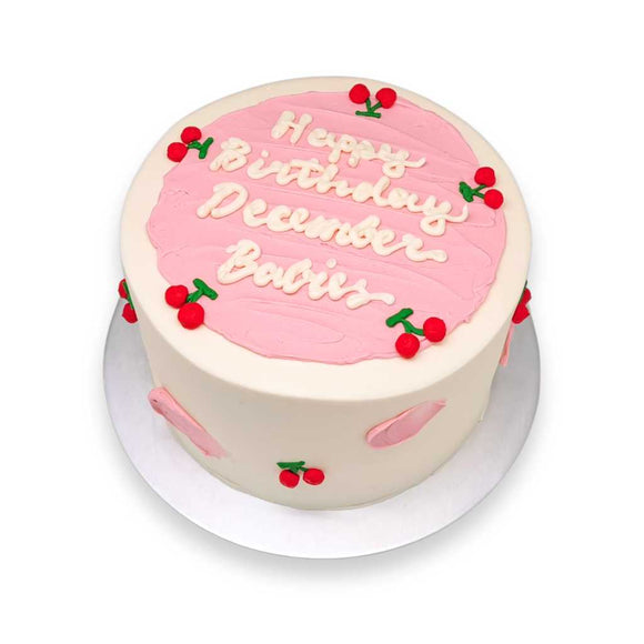 Cherry Blush Cake with white buttercream base, with strokes of pink pastel brushes and personalised message perfect  for birthdays, anniversaries, full month and 100 days celebrations by Sweetest Moments Singapore.