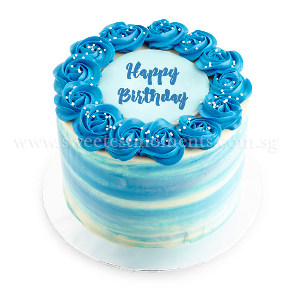 Birthday blue cake on a table Stock Photo - Alamy